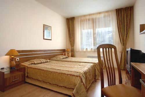 Ένα ή περισσότερα κρεβάτια σε δωμάτιο στο Deluxe Room in Stoykite