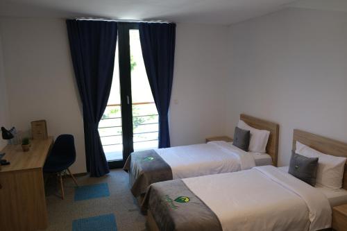 Ένα ή περισσότερα κρεβάτια σε δωμάτιο στο Abi Green Hotel Prevallë
