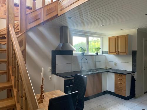 a kitchen with a sink and a counter top at Paradise-Silvergruvan in Hällefors