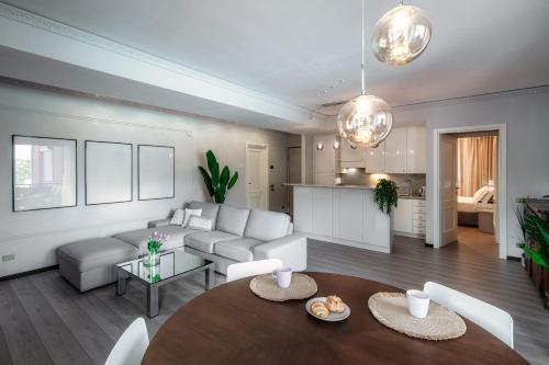 a living room with a couch and a table at Florissa - by MyHomeInComo in Blevio