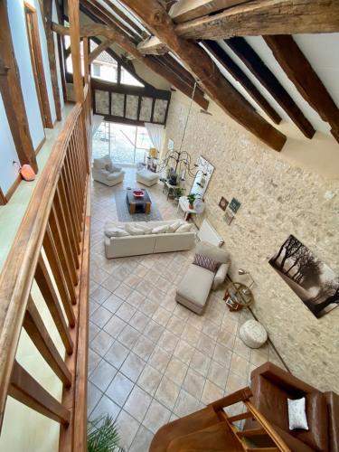 an overhead view of a living room with a stone wall at Anahata Gite in Constant