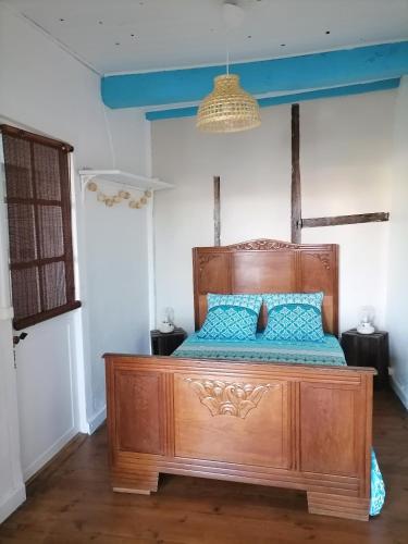 Ένα ή περισσότερα κρεβάτια σε δωμάτιο στο Le grand Houx