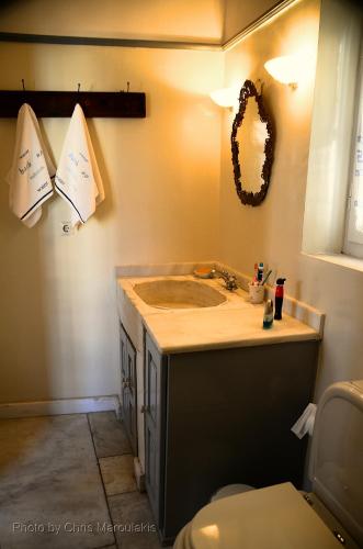 a bathroom with a sink and a toilet at Villa Spetses in Spetses