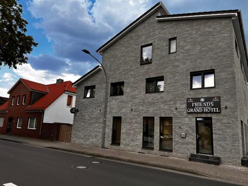 a brick building on the side of a street at Grand Hotel in Soltau