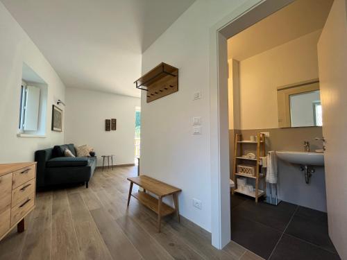 a living room with a sink and a couch at Apartment Ansitz Unterwinkel in Caldaro