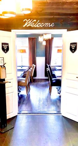 a restaurant with a dining room with tables and chairs at Lapland Lodge in Arvidsjaur