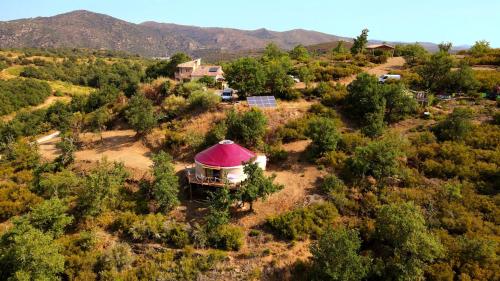 an aerial view of a house with a tent at Yourte contemporaine avec magnifique vue sur les montagnes in Rigarda