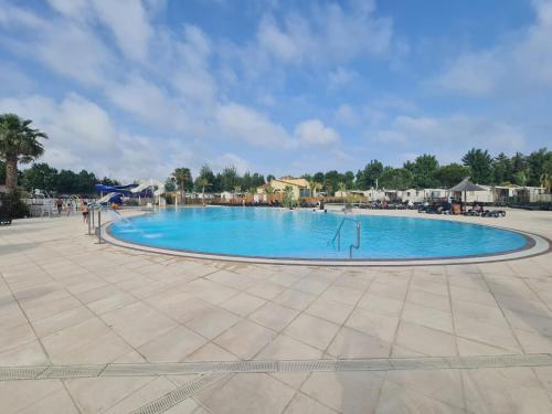 a large swimming pool in a resort at Les sables du midi in Valras-Plage