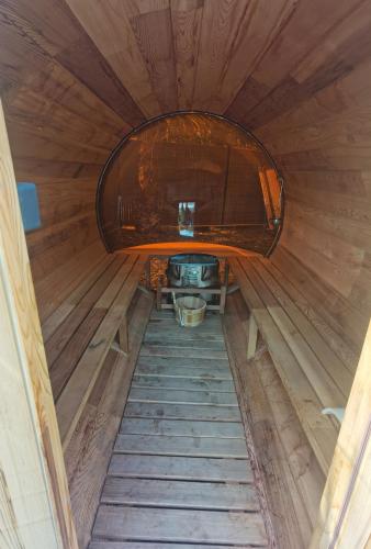 an inside view of a wooden cabin with a round window at Les sables du midi in Valras-Plage