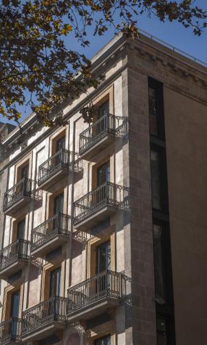 a building with balconies on the side of it at Serras Barcelona in Barcelona