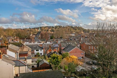 a view of a town with houses and trees at The Sky Penthouse in Winchester