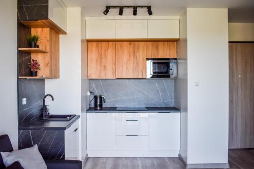 Kuchyňa alebo kuchynka v ubytovaní Apartament blisko morza i Gdańskiej Starówki