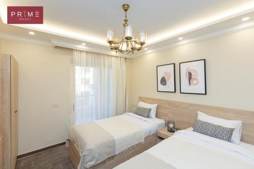 Ένα ή περισσότερα κρεβάτια σε δωμάτιο στο Prime Select Marvel City New Cairo