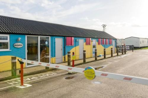 a building with colorful graffiti on the side of it at Central Ingoldmells, Seaview 6 berth in Ingoldmells