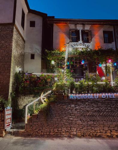 a building with a staircase in front of a building at Avcıoğlu Konak Otel in Safranbolu