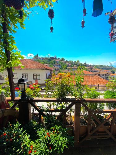 a view from the garden of a house with flowers at Avcıoğlu Konak Otel in Safranbolu