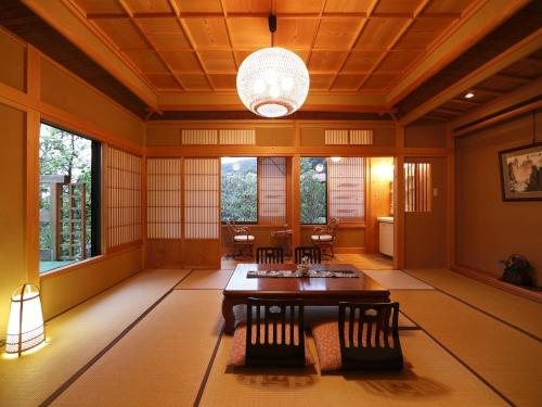 a large room with a table and chairs in it at Sansuisou in Hakone