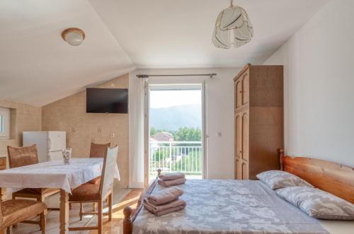 Postel nebo postele na pokoji v ubytování Apartmani Stefan