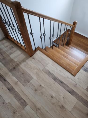 a wooden staircase with wooden flooring in a house at Green in Andrijevica