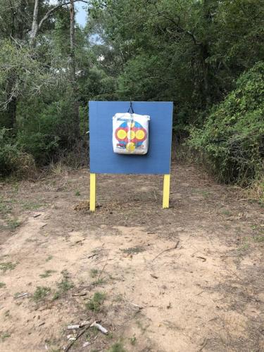 a blue sign with a bag on it in the dirt at The Retreat at Hempstead in Hempstead