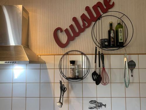 a kitchen with two baskets on the wall with wine bottles at Vintage Apartment Wolf 