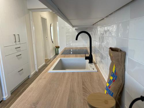 a small bathroom with a sink in the floor at Dashing Central Oasis in Zadar