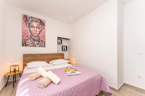 Katil atau katil-katil dalam bilik di Apartmani DMarie