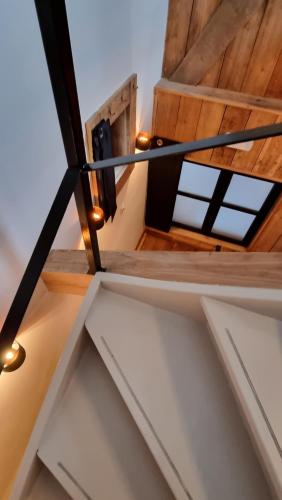 a view from the top of the stairs in a house at Een vleugje wellness in de Voerstreek - Bed & Brocante Onder de Poort in Voeren