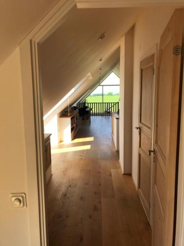 an open hallway with a staircase in a house at Ingridgården in Båstad