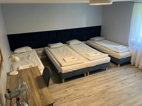 Postel nebo postele na pokoji v ubytování APARTEL Piaseczno