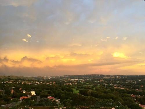 a view of a city under a cloudy sky at Views for Africa in Johannesburg