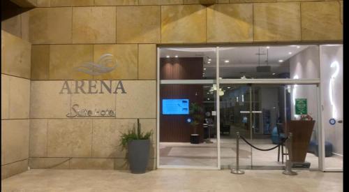 an entrance to an office building with a glass door at סוויטת תשוקה על הים - Passion Suite by the Sea in Bat Yam