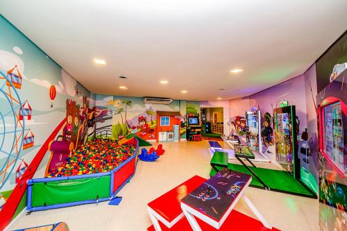 a room with a play room with toys and a play area at Laghetto Resort Golden Oficial in Gramado