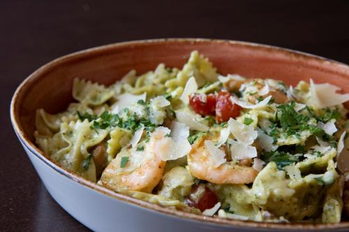 a bowl of pasta with shrimp and broccoli at Sonesta San Jose - Milpitas in Milpitas