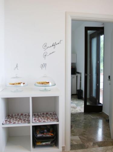 a room with a table with plates of food on it at Bonaventura b&b and Bonaventura food in Tollo