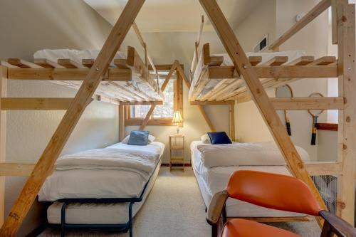 two bunk beds in a room with a ladder at Make Way for the Mountains in Truckee