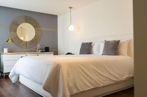 Кровать или кровати в номере Casa Cuarzo Hotel Boutique