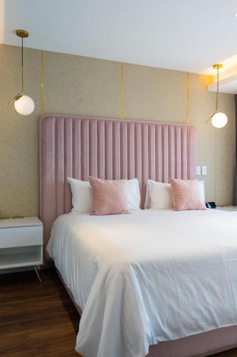 Кровать или кровати в номере Casa Cuarzo Hotel Boutique