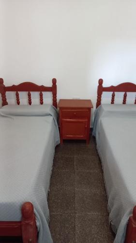two beds sitting next to each other in a room at Departamento de Hugo in Cafayate