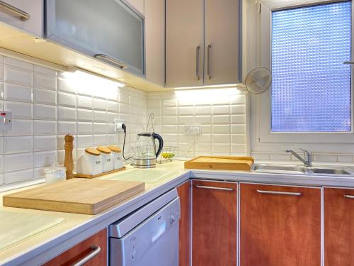 a kitchen with a sink and a counter top at 4 Bedroom Deluxe Villa with Mountain and Sea View in Kérynia