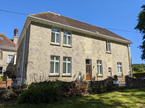 an old stone house with a yard at Shanklin Manor in Shanklin