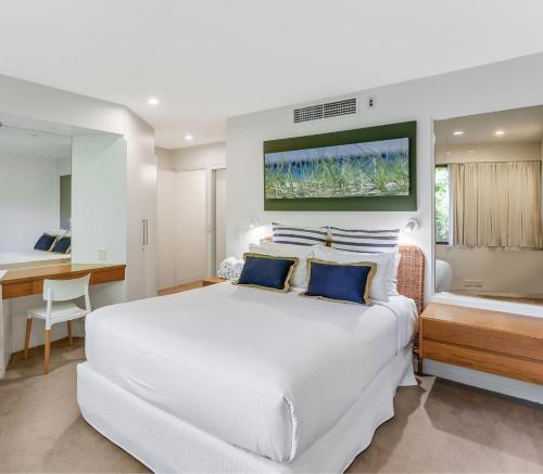 Ένα ή περισσότερα κρεβάτια σε δωμάτιο στο Little Cove Court - Apartment 11