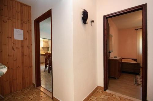 a room with a door leading to a bedroom at Apartments with a parking space Mirca, Brac - 728 in Mirce