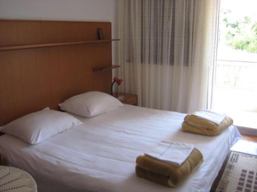 Ένα ή περισσότερα κρεβάτια σε δωμάτιο στο Apartment Maslinica 774b