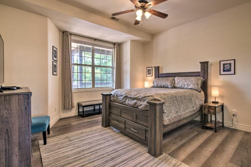 a bedroom with a bed and a ceiling fan at Luxe Mtn-View Condo in Branson with Hot Tub Access! in Branson
