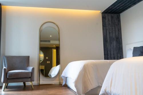 Кровать или кровати в номере Casa Cuarzo Hotel Boutique