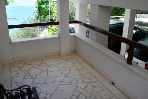 a balcony with a view of the ocean at Apartments by the sea Pisak, Omis - 1014 in Pisak