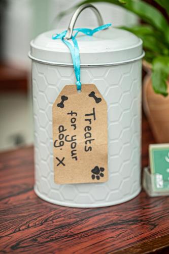 a jar with a tag on it sitting on a table at Kings Lodge in Torquay