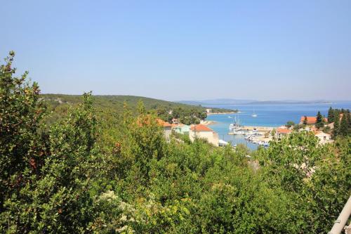 a view of a town and a body of water at Apartment Zman 887c in Žman