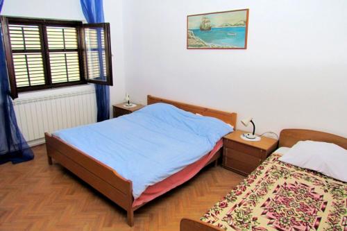 Posteľ alebo postele v izbe v ubytovaní Apartments with a parking space Kraj, Pasman - 696